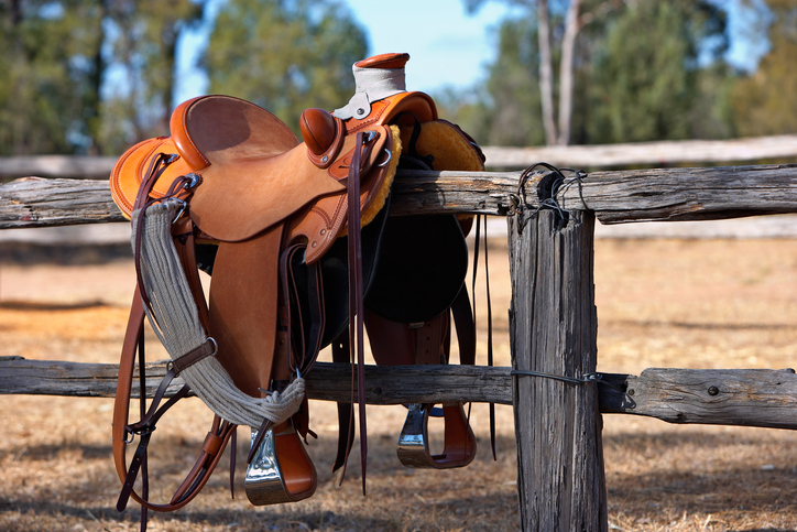Western Horse Saddle and Fence stock photo